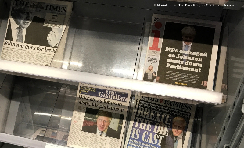 Newsstand showing newspapers with headlines about Boris Johnson: Credit: The Dark Knight/Shutterstock